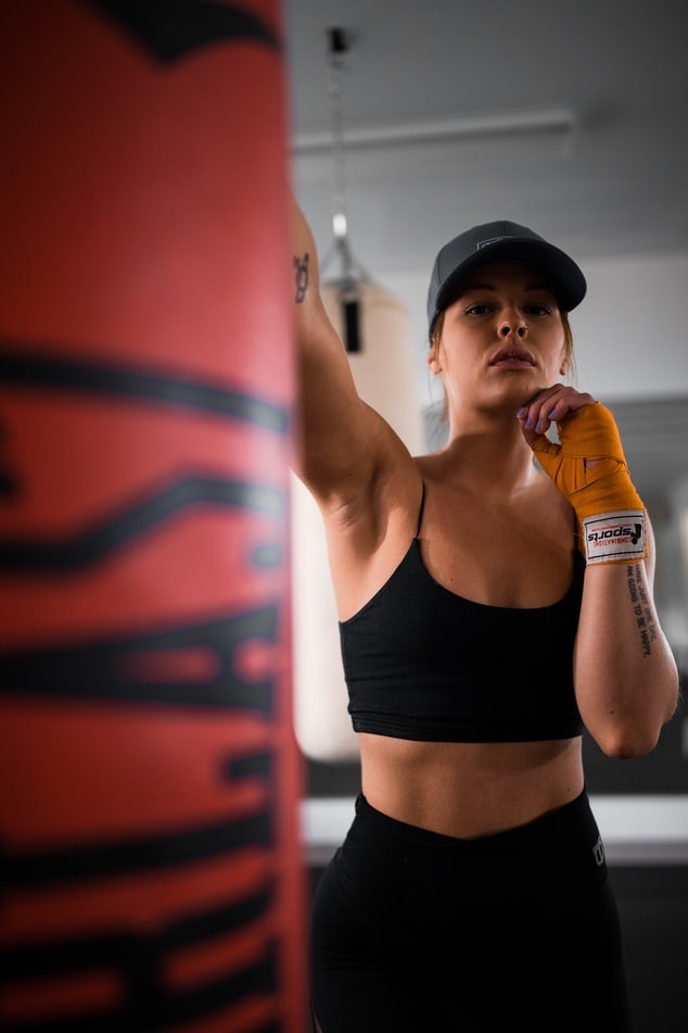 MMA fighter hitting a punching bag