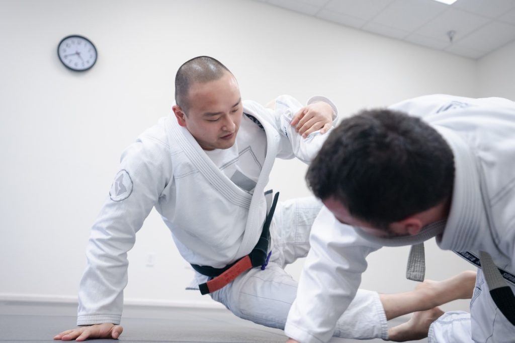 Jiu Jitsu instructor demonstrating moves during a class