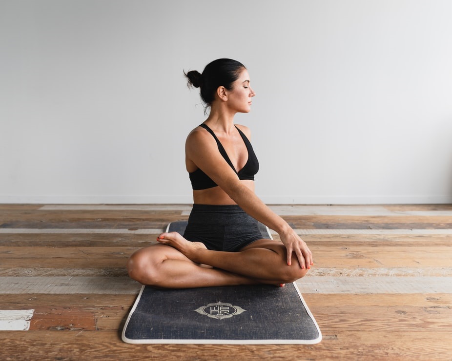 Yoga instructor demonstrating a simple twist