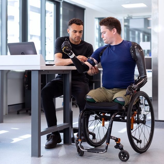 Physical therapist working with an amputee