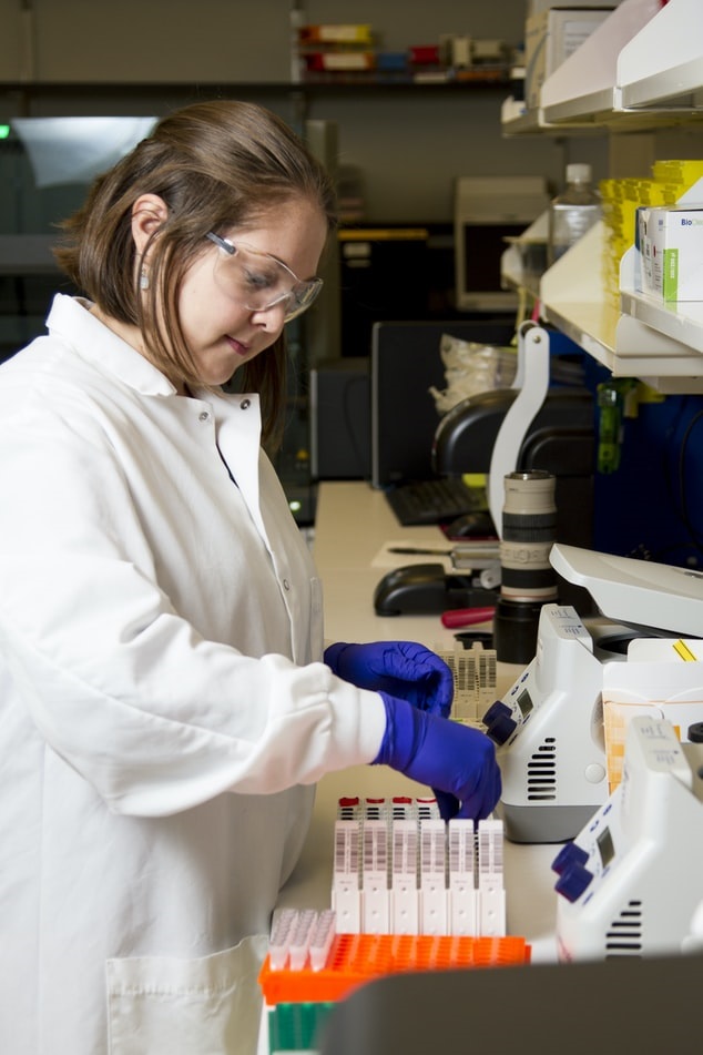 Phlebotomist analyzing blood samples in laboratory